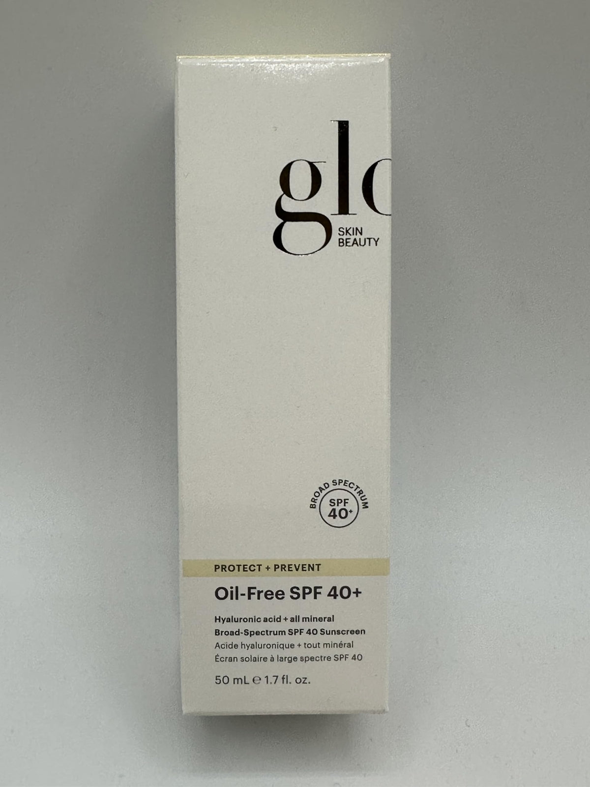 Glo Skin Beauty applying sunscreen on skin showing smooth, breathable coverage