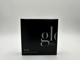 Glo Skin Beauty travel flatlay with compact beside essentials for on-the-go touchups