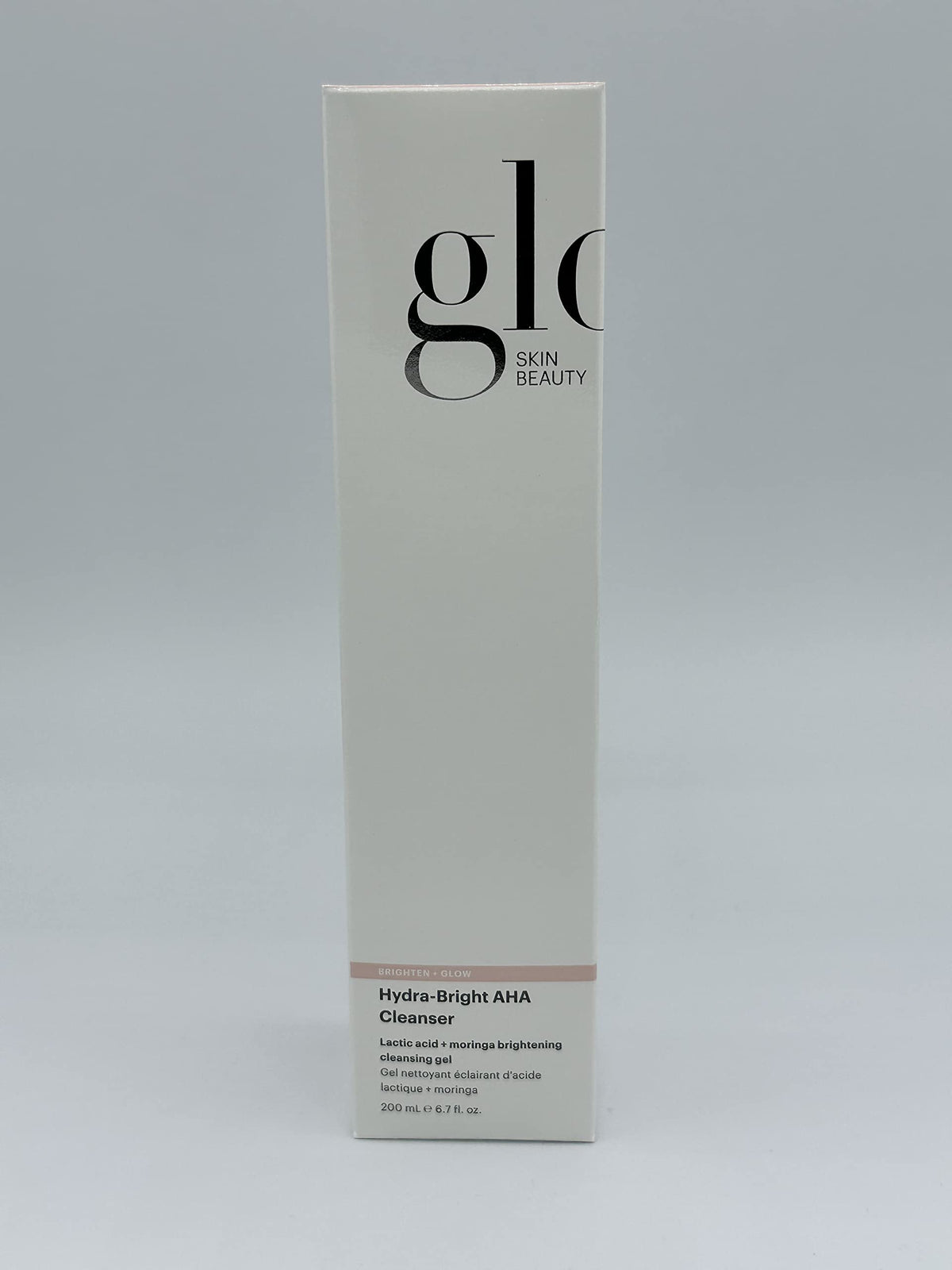 Glo Skin Beauty size comparison with 6.7 oz bottle showing travel-friendly benefit