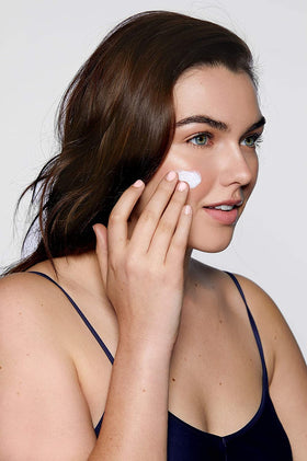 Glo Skin Beauty jar beside credit card for 1.7 oz size and portability clarity