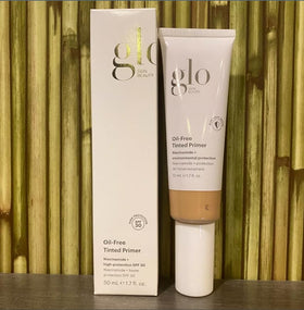 Glo Skin Beauty tube beside coin showing 1.7 fl oz size