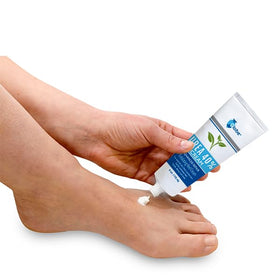 Globe cream texture spread on surface showing rich emollient and easy absorption