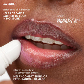 Glossier Balm Dotcom applied to lips displaying smooth moisturized finish