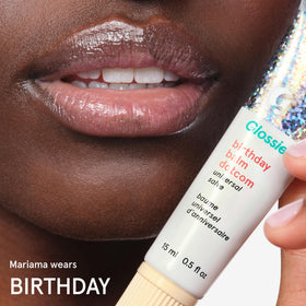 Glossier Balm Dotcom applied to cuticles to soften and nourish skin