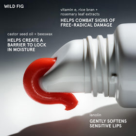 Glossier Balm Dotcom applied to lips demonstrating subtle coral tint benefit