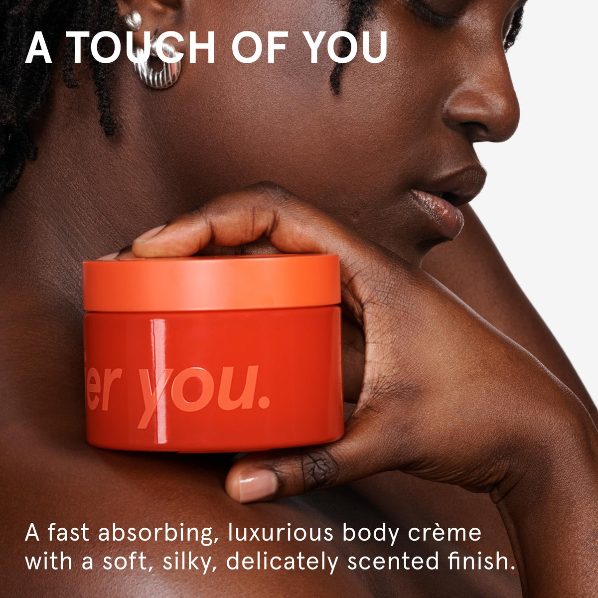 Glossier open tub revealing smooth cream texture for quick absorption and hydration