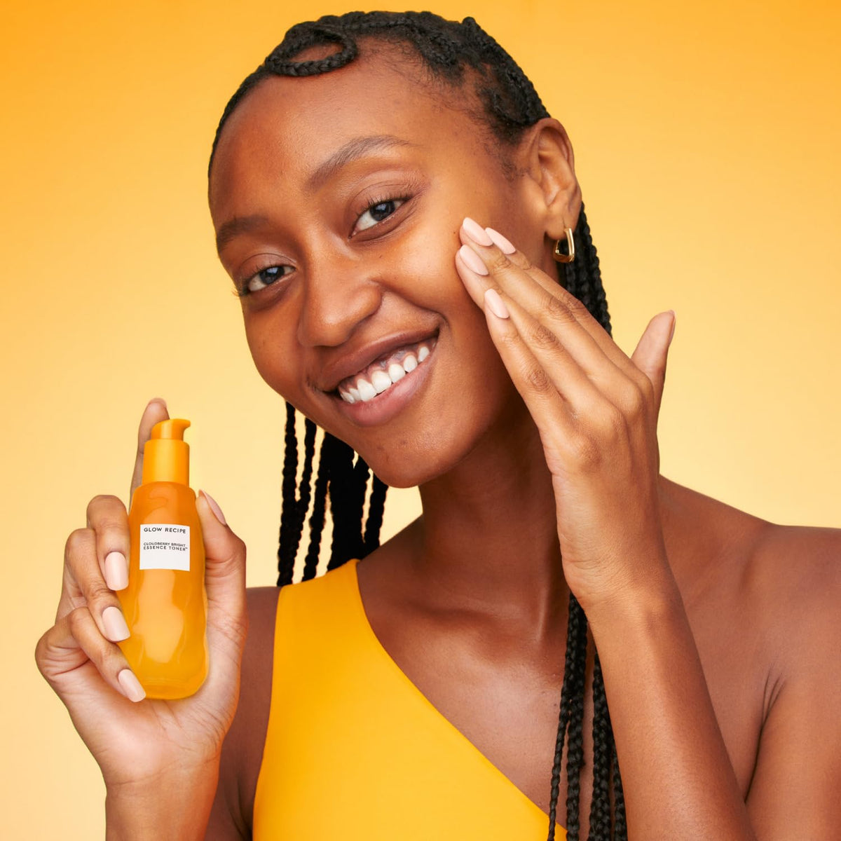 Glow Recipe 30 ml bottle next to hand showing compact travel size