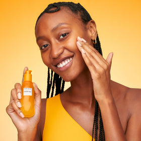 Glow Recipe 30 ml bottle next to hand showing compact travel size