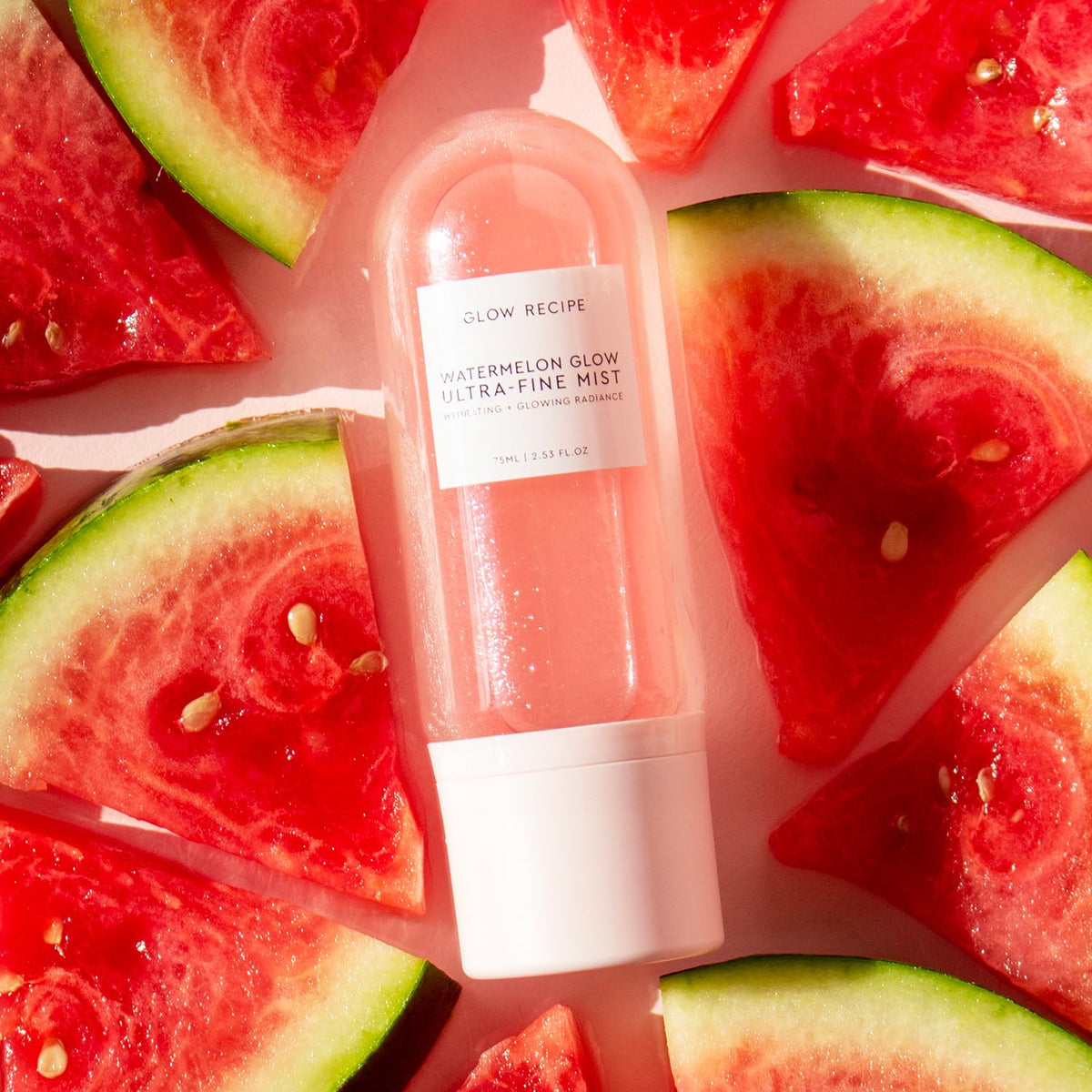 Glow Recipe mist spraying a fine cloud to instantly hydrate skin