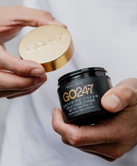 Finger styling dry hair with GO247 grooming cream for natural finish and touch-ups