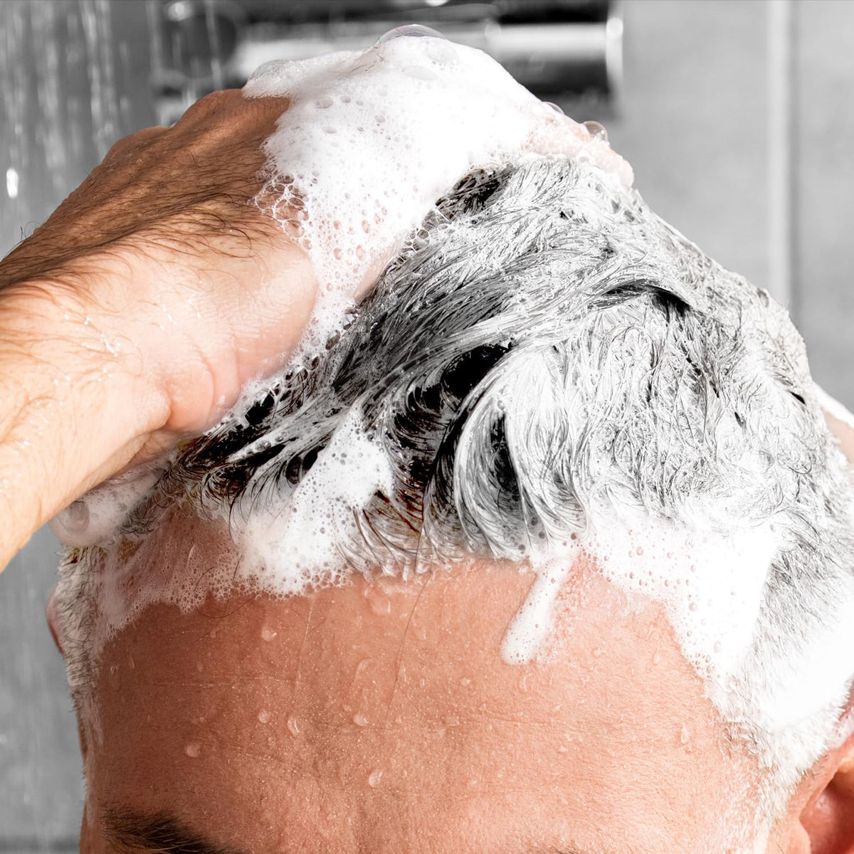 Godefroy shampoo applied to beard demonstrating brassy-tone reduction benefit