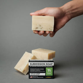 Gold BJJ bar in shower setting showing refreshing clean after grappling session