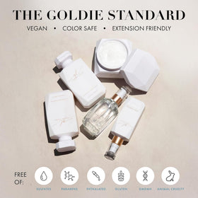 Goldie Locks 4 fl oz bottle in hand showing compact travel-friendly size
