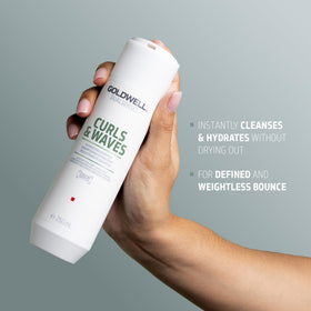 Goldwell shampoo in-use in shower creating gentle lather for curls