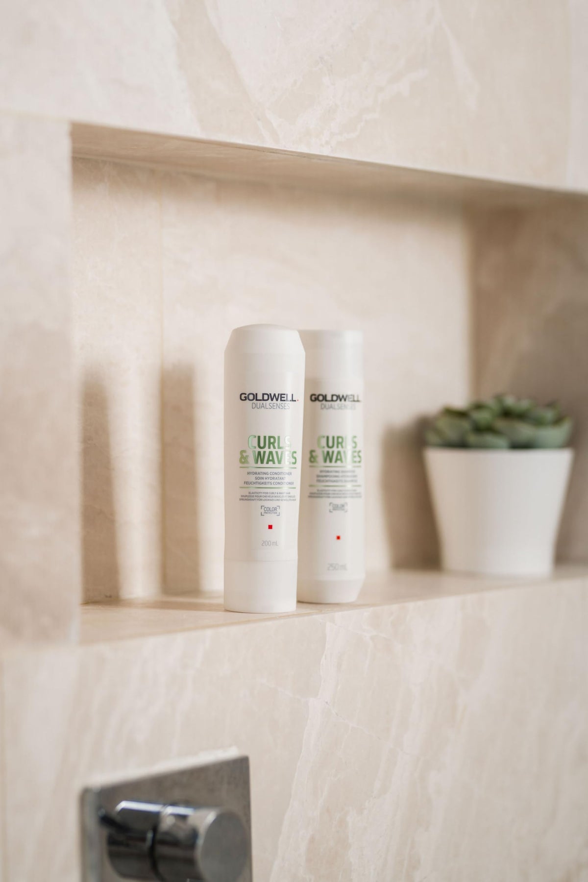 Goldwell label closeup showing microPROtec and FadeStopFormula focus