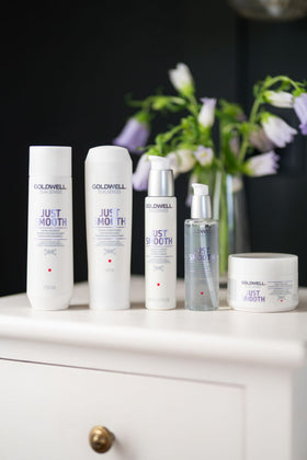 Goldwell 1L bottle size comparison beside everyday items for scale