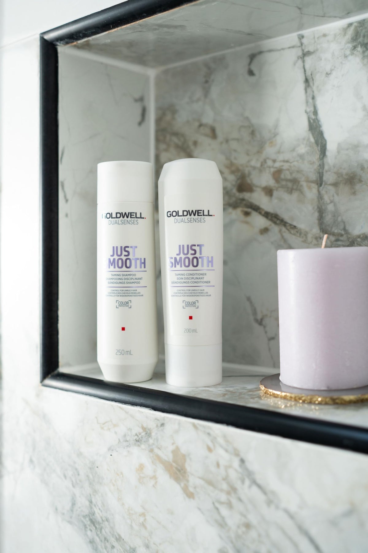 Goldwell bottle staged in bathroom indicating daily at-home smoothing routine