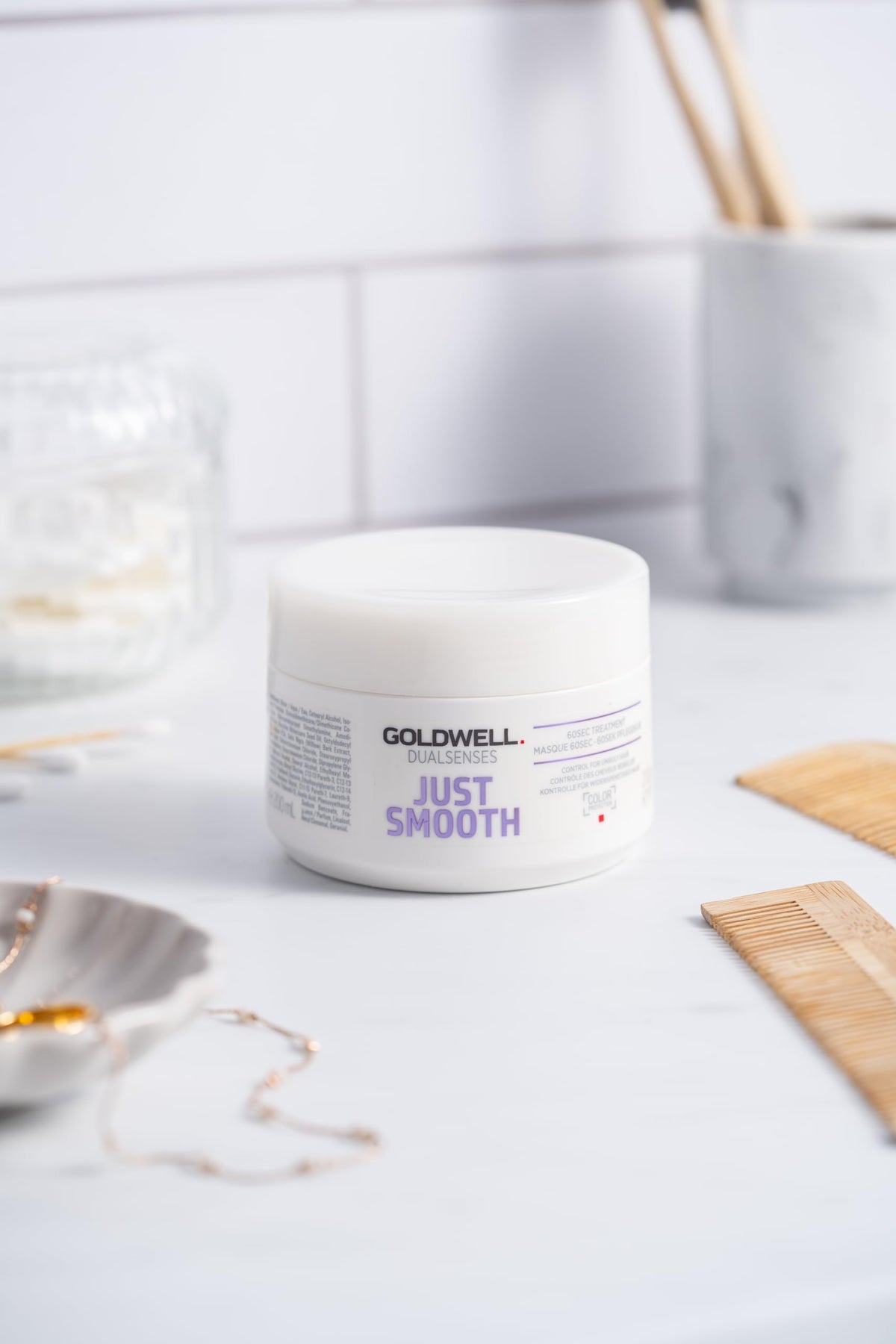 Goldwell 200ml bottle beside common items showing true size and portability