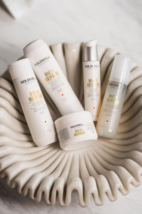 Goldwell bottle on bathroom shelf illustrating professional look and convenience