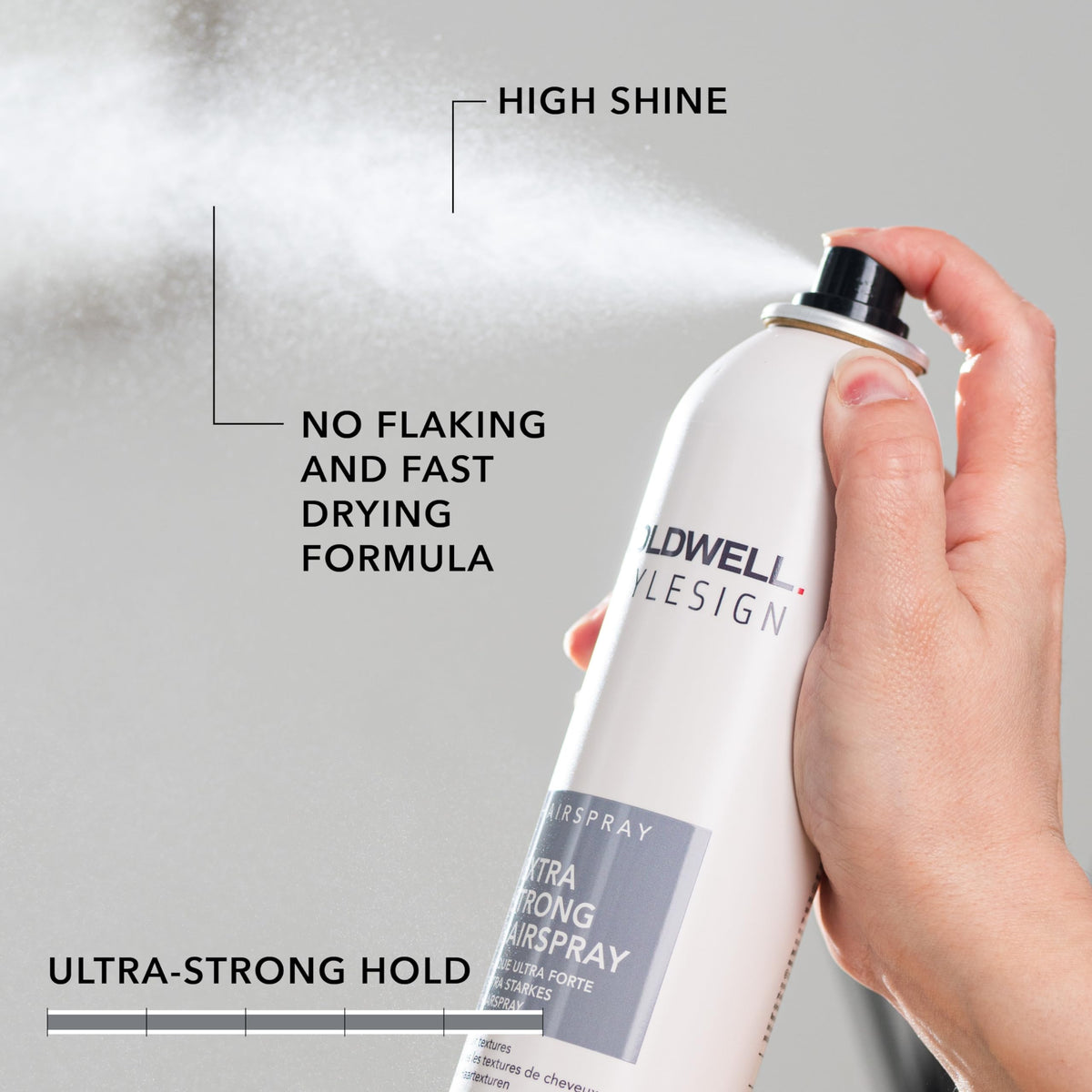 Goldwell hairspray being sprayed on styled hair to show strong hold in action