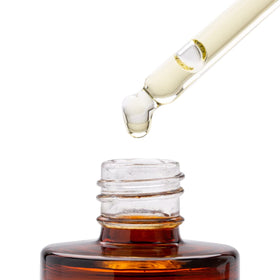 Good Molecules oil placed with serums and moisturizer to show layering
