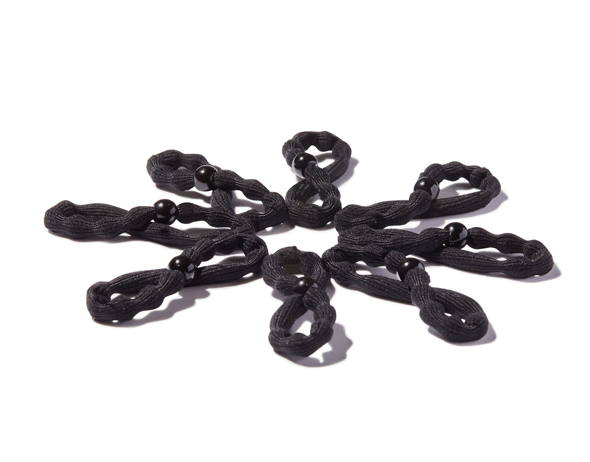 GOODY elastic securing a thick braid for reliable, comfortable grip