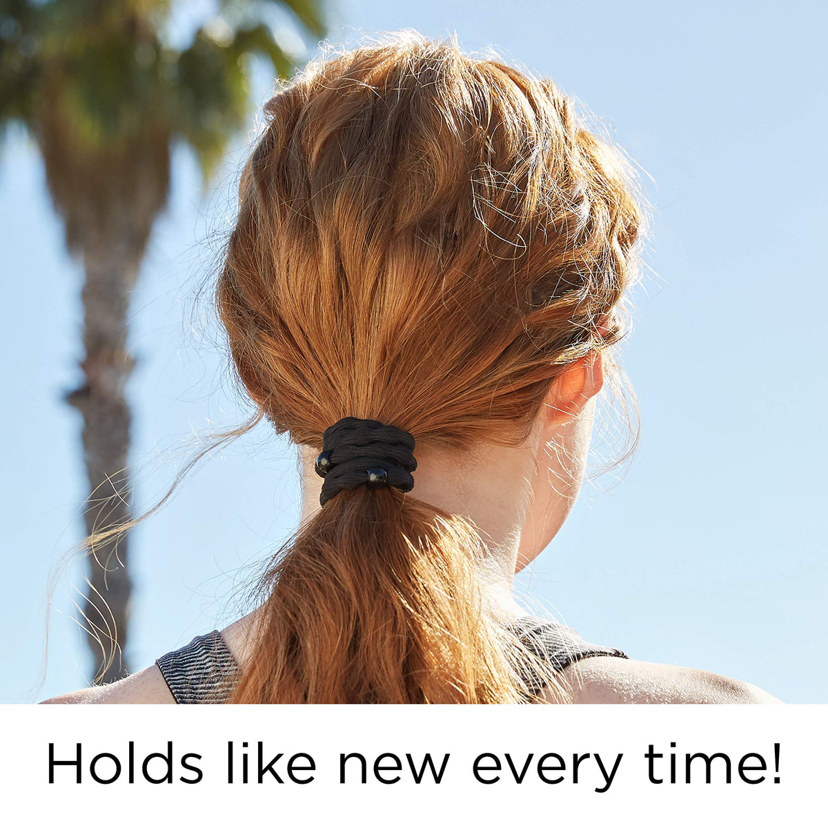 GOODY elastic worn on wrist and holding ponytail for secure no-pull style