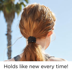GOODY elastic worn on wrist and holding ponytail for secure no-pull style