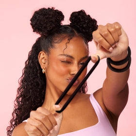 GOODY worn in casual updo outdoors displaying discreet black style and durable hold