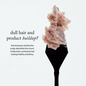 goop scrub applied in shower illustrating effective scalp massage and rinseability