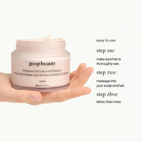 goop bottle held in hand for scale showing 6.7 fl oz travel-friendly size