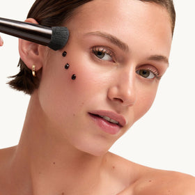 goop Summertone on brush showing buildable coverage and concentrated application