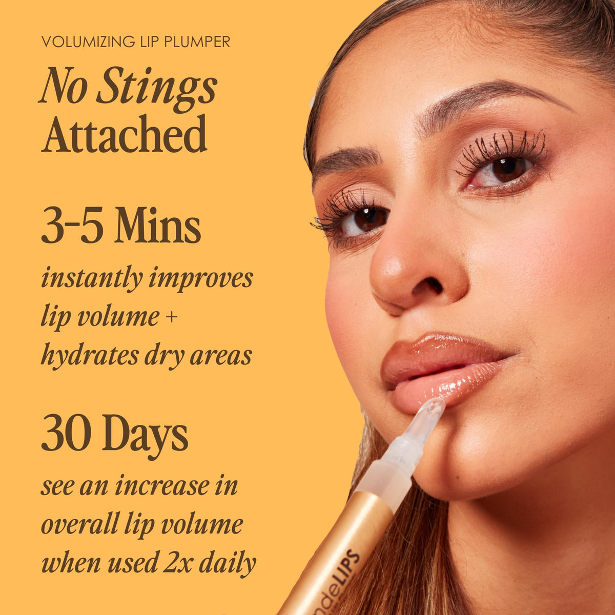 Grande Cosmetics GrandeLIPS clear gloss texture showing shiny, hydrating finish