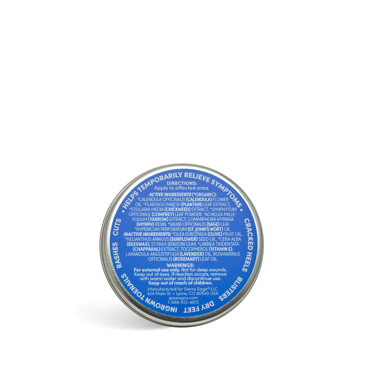 Open Green Goo tin beside ruler and label showing size, ingredients, and brand info