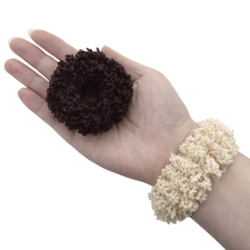 Grutyopkn scrunchie in hand showing size and stretch for thick hair