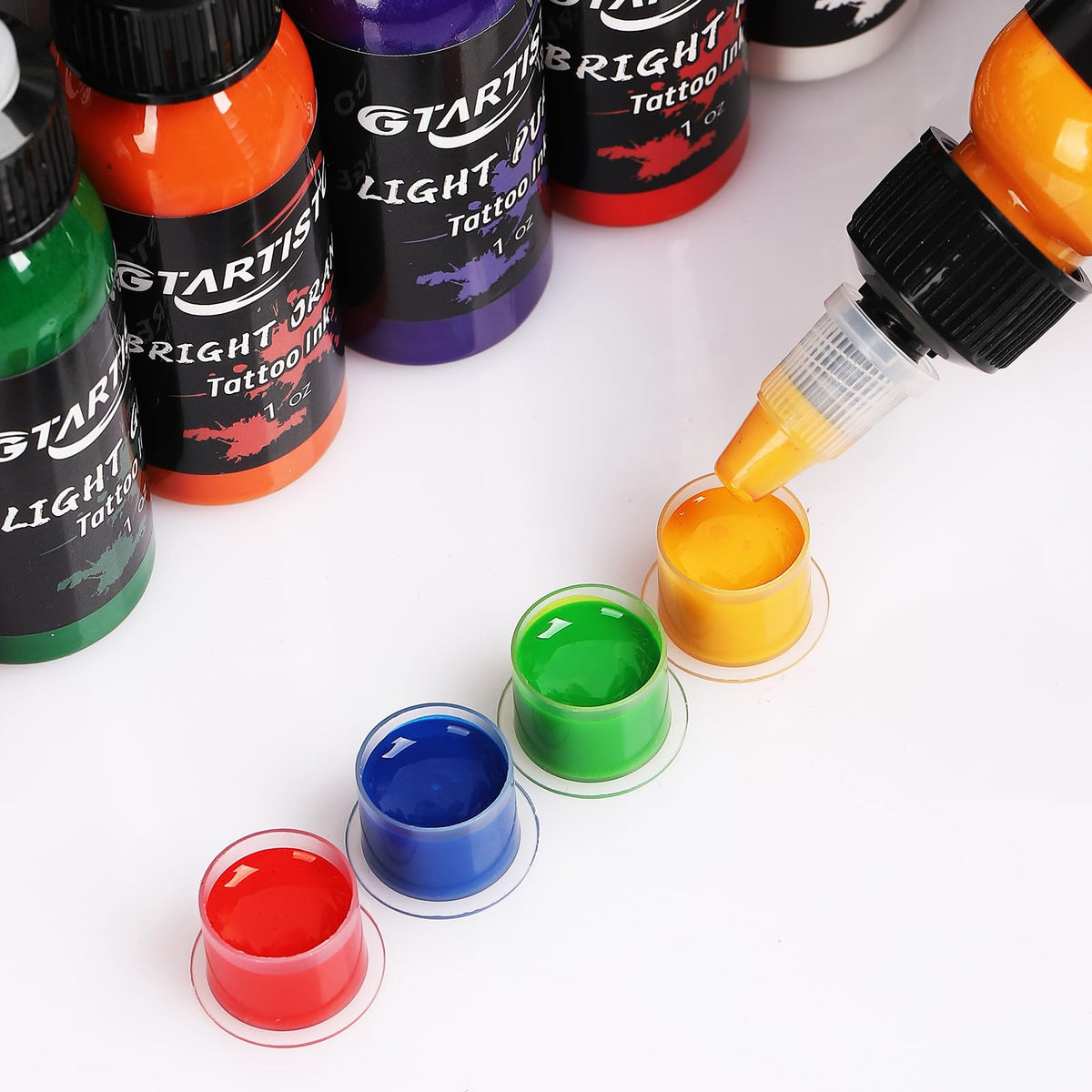 GTARTISTOO artist dispensing ink into cap during session benefit: hygienic workflow