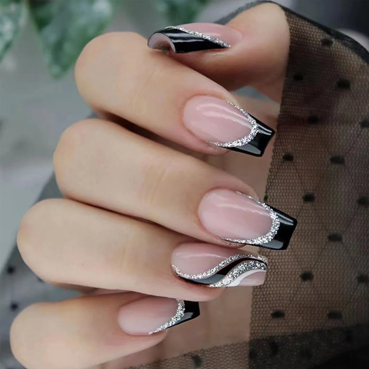 GUFUGU adhesive tab being applied to nail for fast secure hold