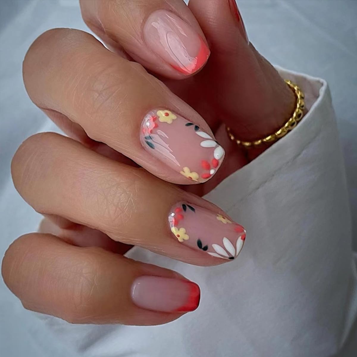 GUFUGU arranged display of six different floral short square nail sets for color choices