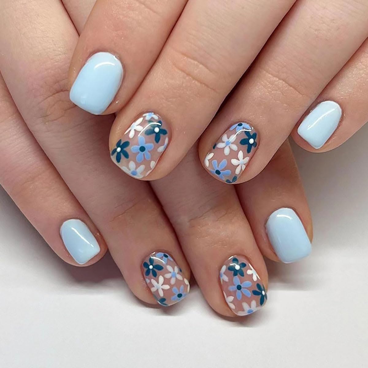 GUFUGU finished manicure on hands demonstrating floral look for events