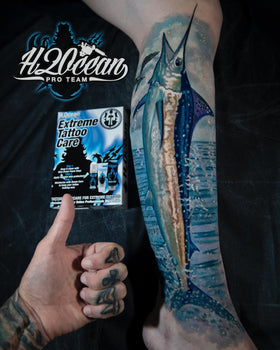 H2Ocean Aquatat applied to fresh tattoo demonstrating protective barrier
