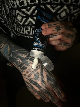 H2Ocean tube held in hand for scale, emphasizes portable 2.5 oz convenience