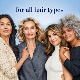 Hair Biology lifestyle shot of woman blow-drying for added volume