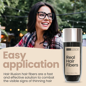 Close-up of Hair Illusion black fibers showing natural texture and blend benefit