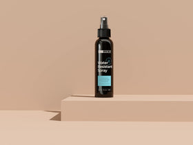 Hair Illusion spray action mist in air demonstrating even coverage benefit