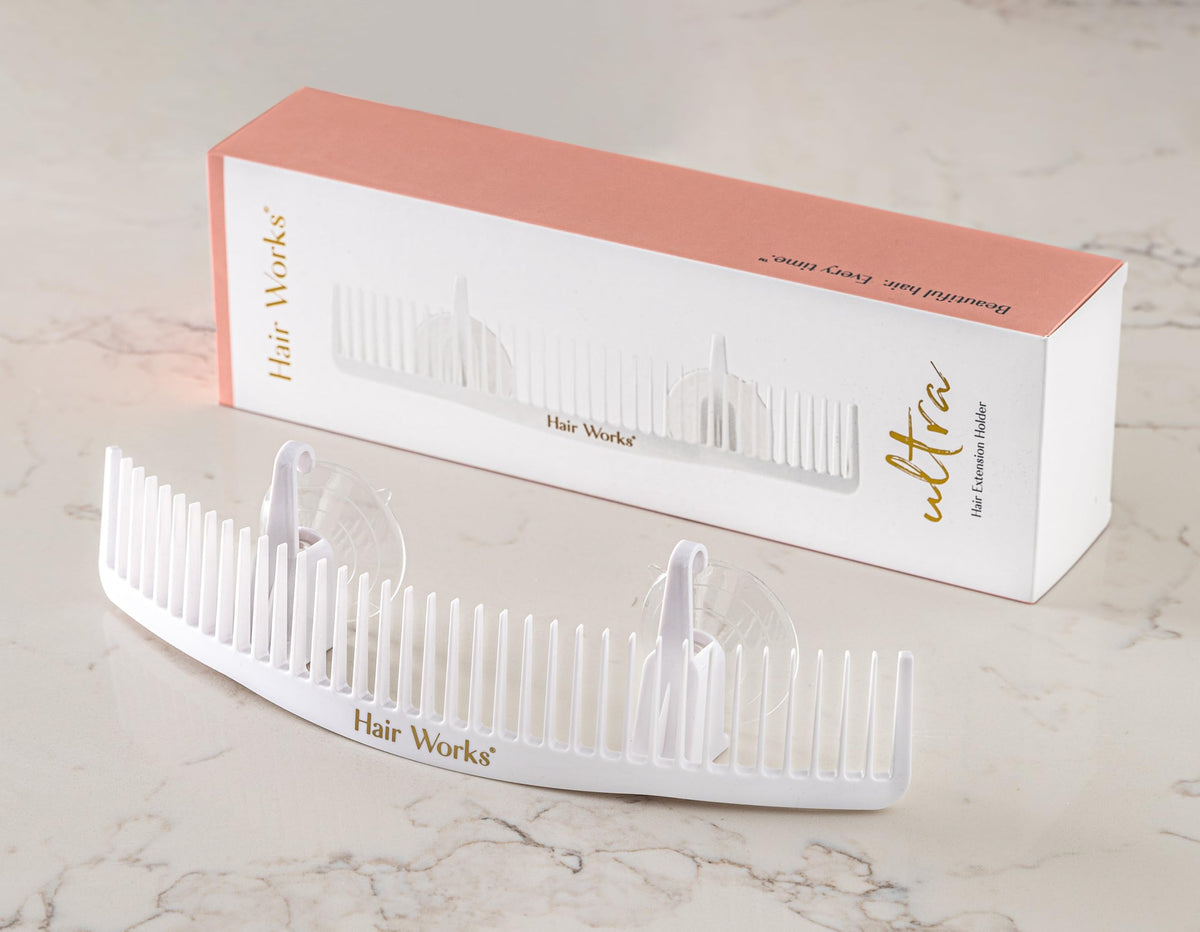 Hair Works holding an extra-wide beaded weft for safe styling