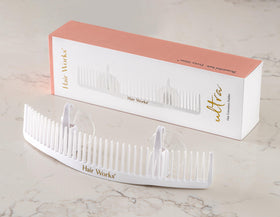 Hair Works holding an extra-wide beaded weft for safe styling