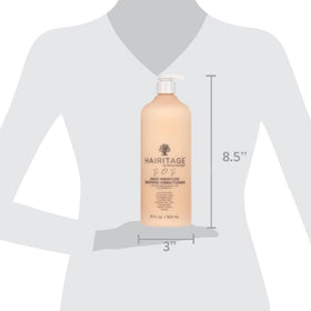 Hairitage applied to wet curly hair in salon for deep hydration and detangling