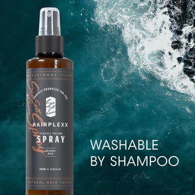 Hairplexx bottle in hand to show size and travel-friendly benefit