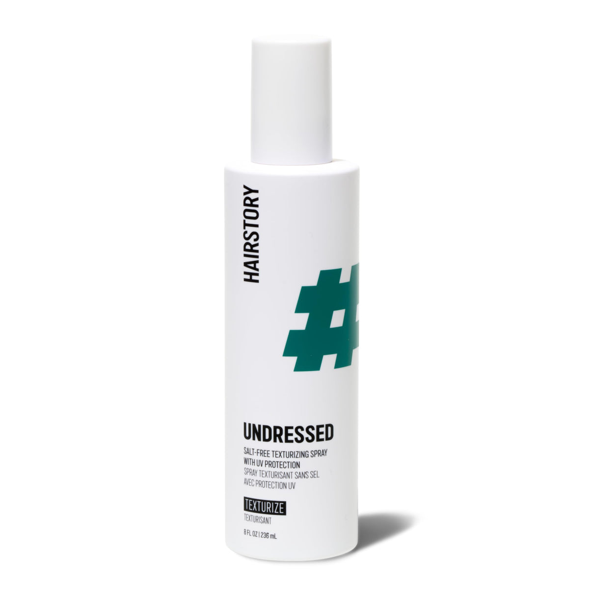 Hairstory front bottle shot showing Undressed spray and packaging benefit
