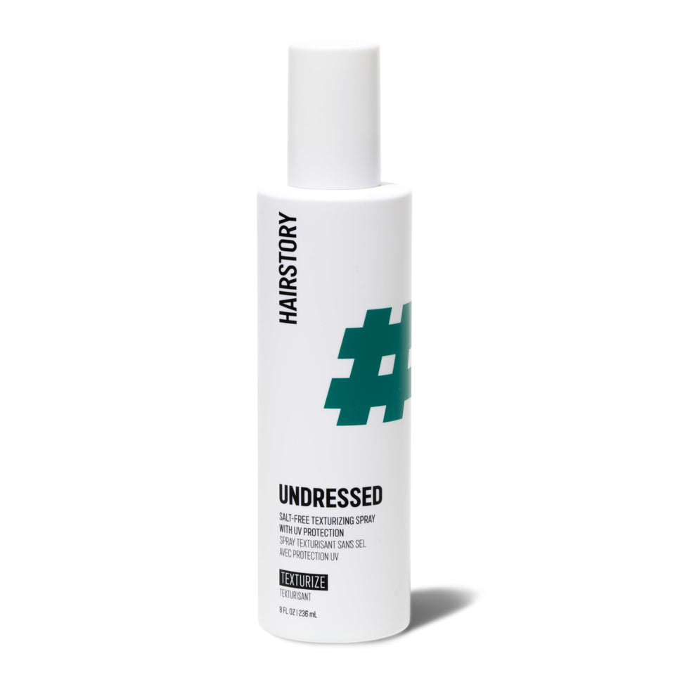 Hairstory front bottle shot showing Undressed spray and packaging benefit